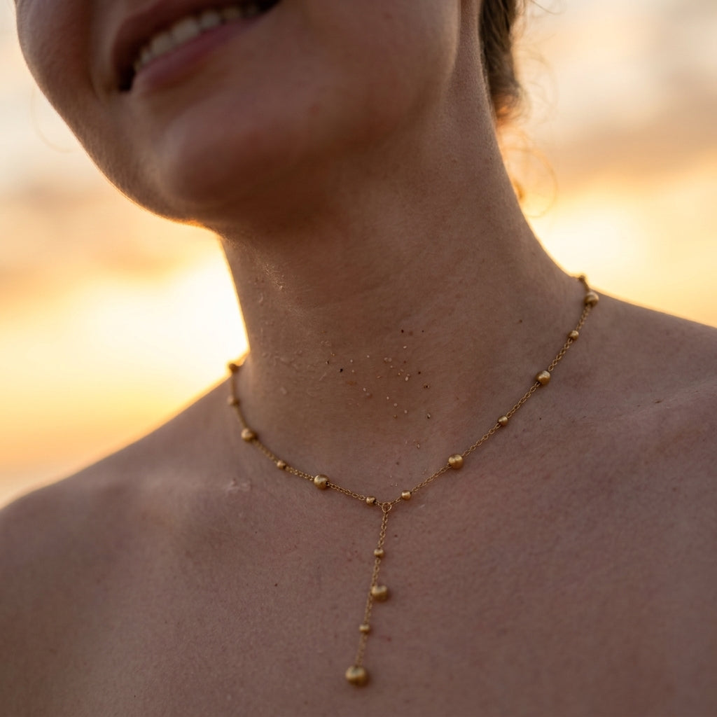 Elegant Y‑Drop Gold Bead Necklace