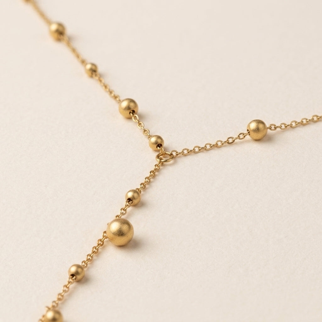 Elegant Y‑Drop Gold Bead Necklace